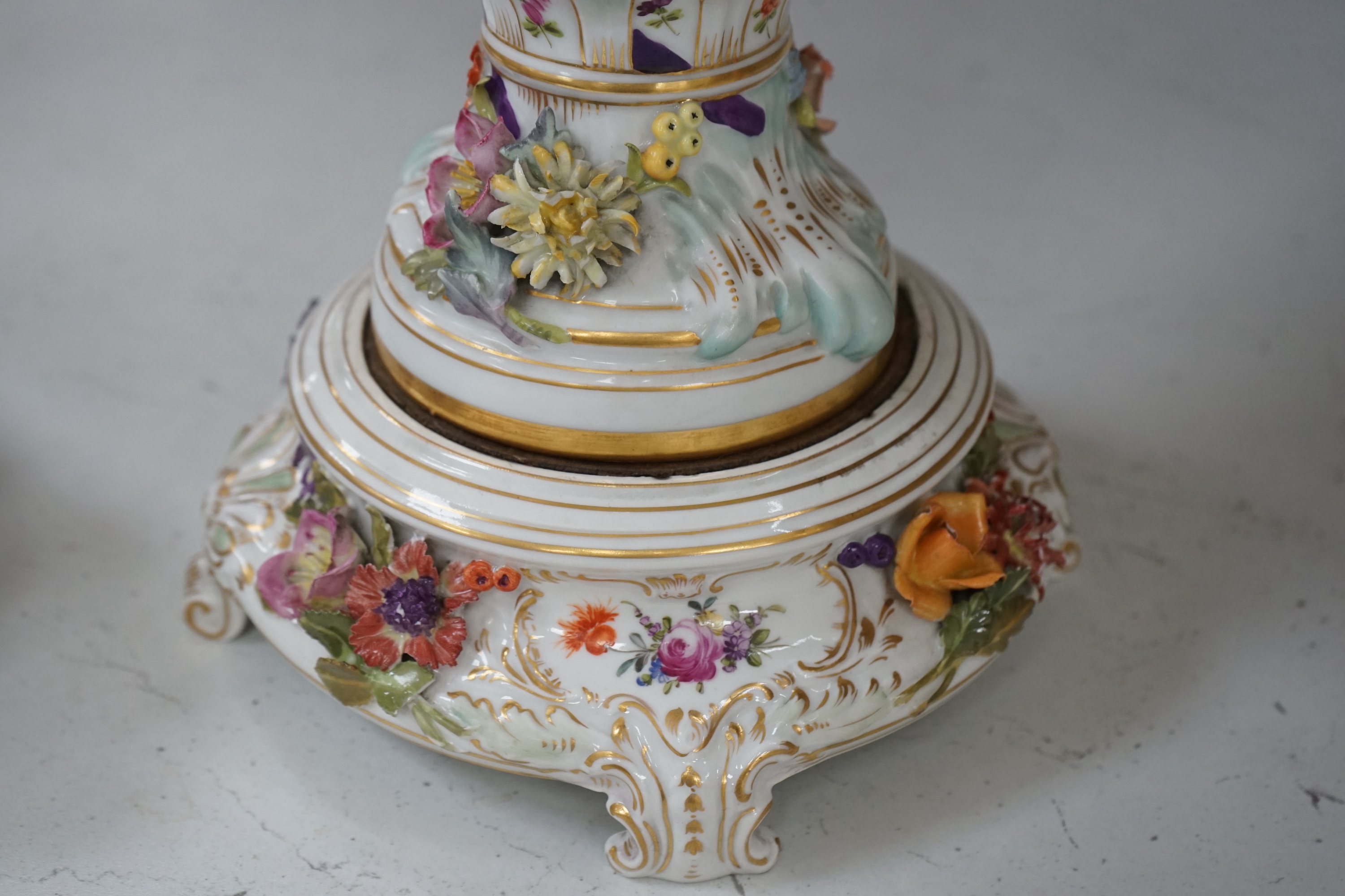 A Dresden floral encrusted porcelain incense burner hand painted with figures annd flowers, together with a similar lidded box, largest 52cm high. Condition - some losses